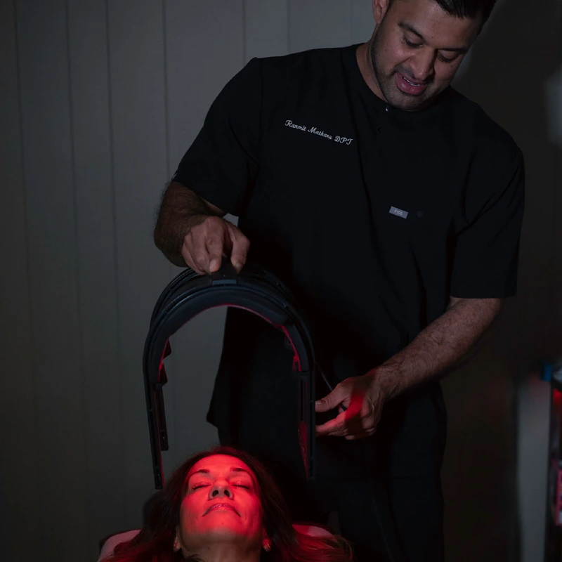 Dr. Ranmit Providing Infra Red Therapy at UWS office